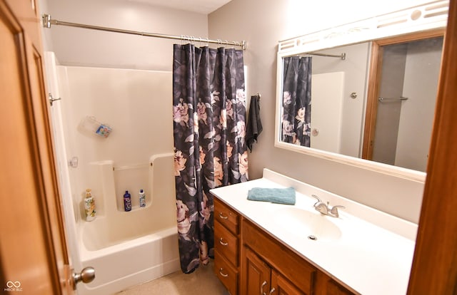 bathroom featuring vanity and shower / bathtub combination with curtain