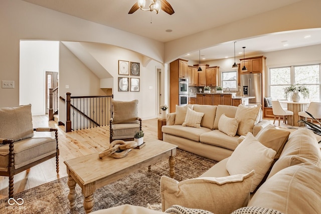 living area with recessed lighting, light wood finished floors, and ceiling fan