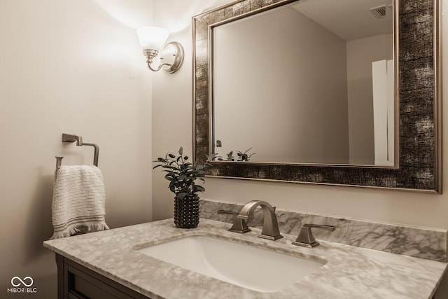 bathroom with visible vents and vanity