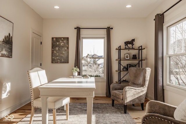 office featuring a wealth of natural light, baseboards, light wood-style floors, and recessed lighting