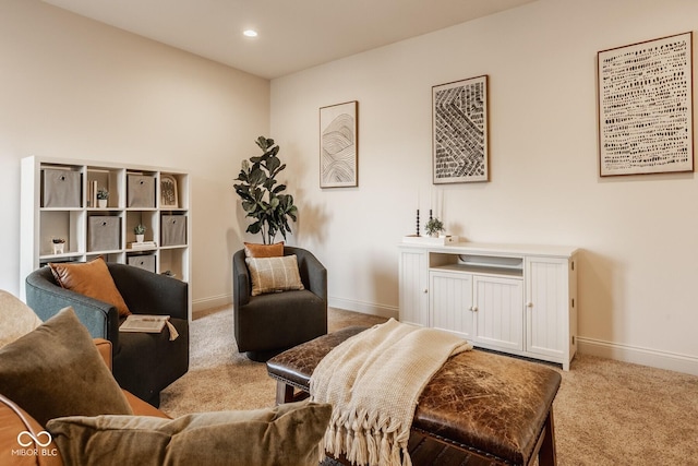 living area featuring recessed lighting, baseboards, and carpet floors