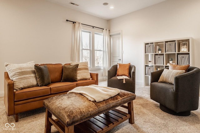 living area featuring recessed lighting, light colored carpet, visible vents, and baseboards