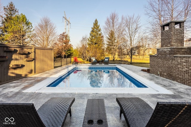 view of swimming pool featuring a fenced in pool and a patio