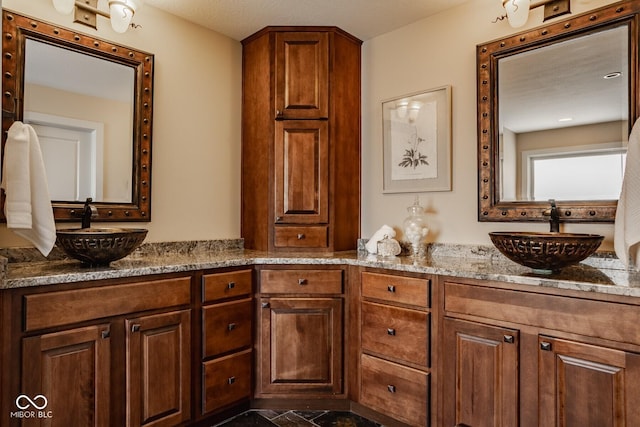 bathroom featuring double vanity and a sink