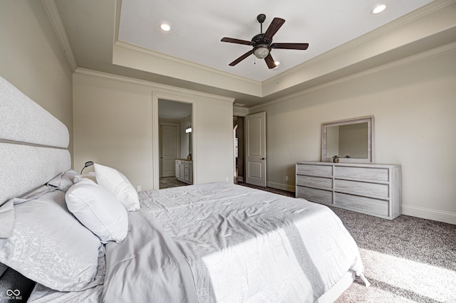 bedroom featuring recessed lighting, a tray ceiling, baseboards, and carpet flooring