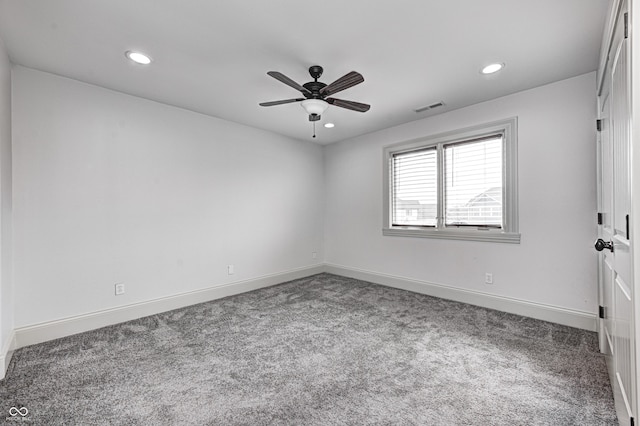 empty room with recessed lighting, carpet flooring, baseboards, and visible vents