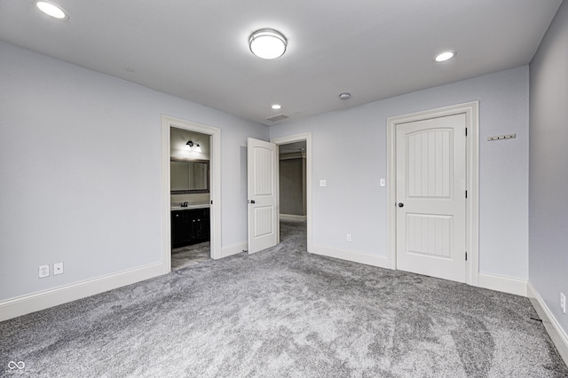 unfurnished bedroom with carpet flooring, recessed lighting, and baseboards