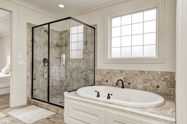 full bath featuring a stall shower, crown molding, and a garden tub