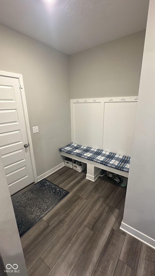 mudroom featuring baseboards and wood finished floors