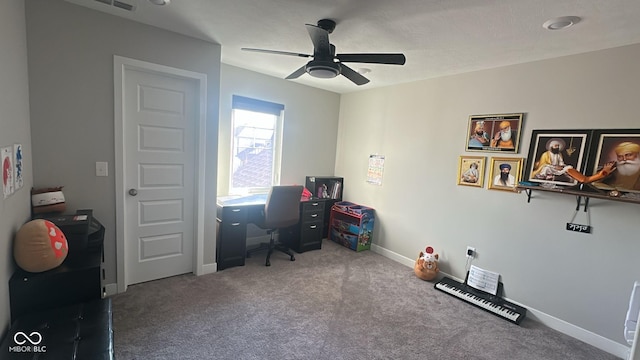 carpeted office with visible vents, a ceiling fan, and baseboards