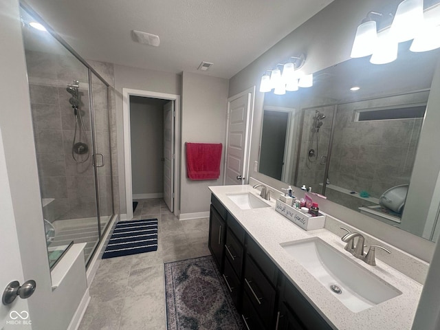 full bath featuring a shower stall and a sink