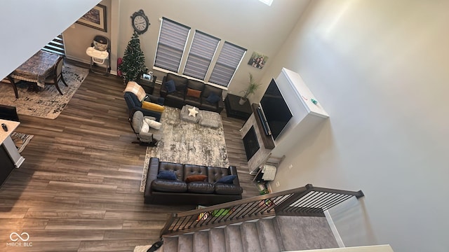 living area featuring baseboards and wood finished floors