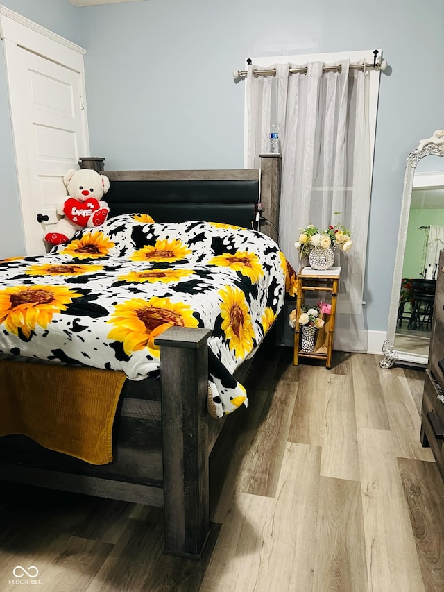 bedroom featuring wood finished floors