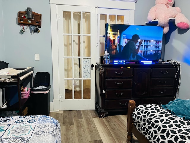 bedroom with wood finished floors