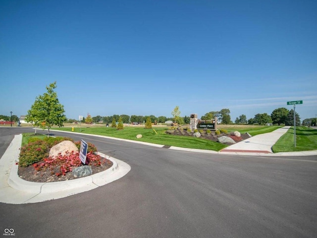 view of road featuring curbs