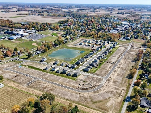 aerial view with a rural view and a water view