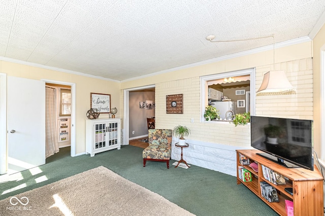 living area with carpet flooring, a textured ceiling, a fireplace, and crown molding