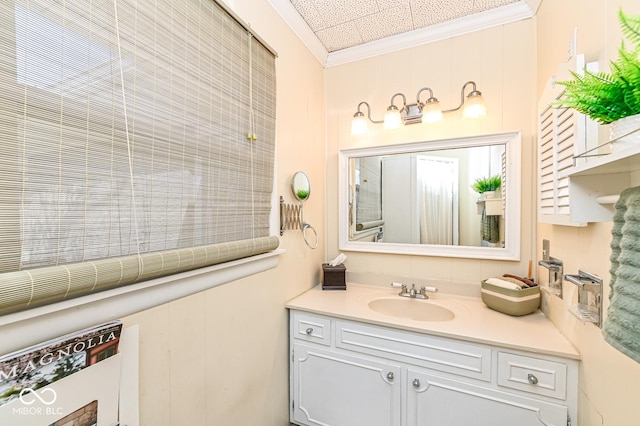 bathroom featuring vanity and ornamental molding