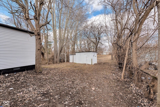 view of yard with a storage unit and an outdoor structure