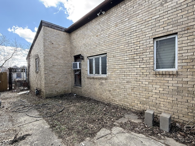 view of property exterior featuring brick siding