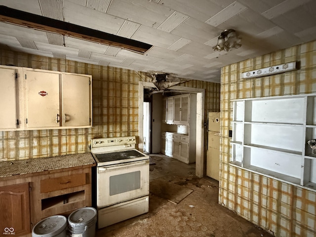 kitchen with white range with electric stovetop