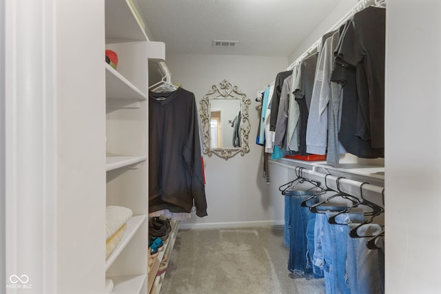 walk in closet with carpet flooring and visible vents