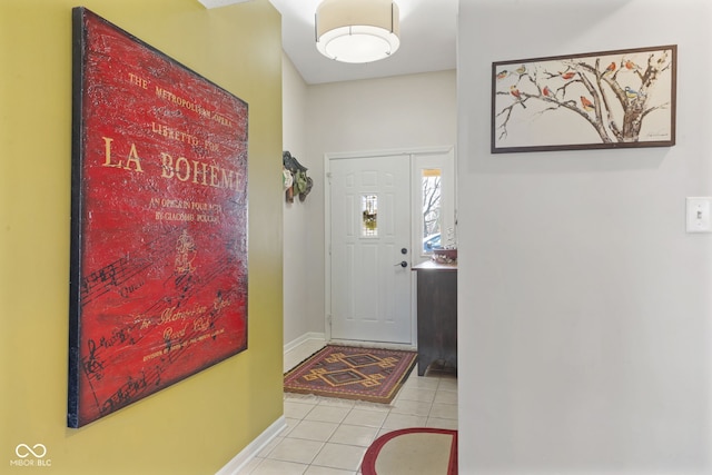 entryway with tile patterned floors and baseboards