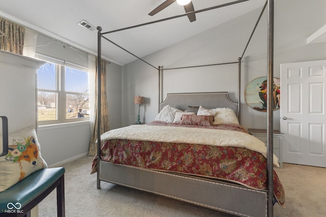 bedroom featuring visible vents, a ceiling fan, lofted ceiling, and carpet floors