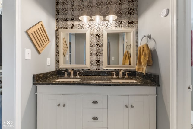 bathroom with double vanity and a sink