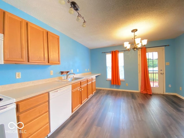 kitchen with white appliances, dark wood-type flooring, light countertops, a textured ceiling, and a sink