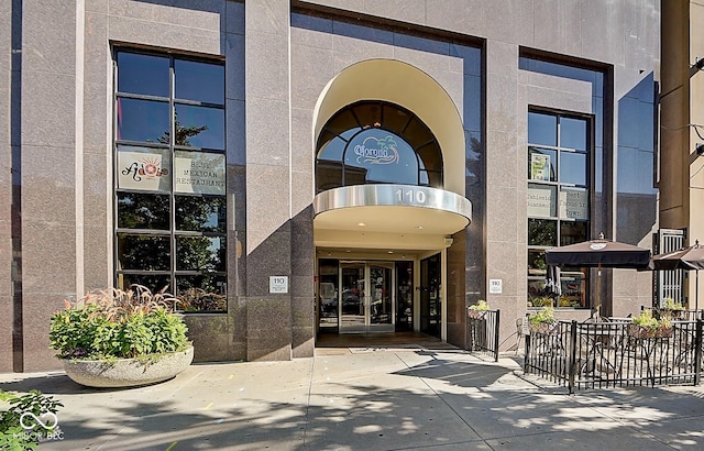 property entrance featuring stucco siding