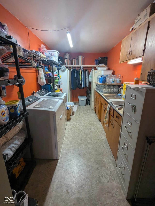 interior space with a sink and independent washer and dryer