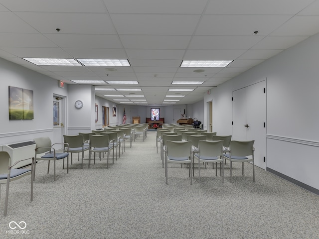 dining space featuring a drop ceiling