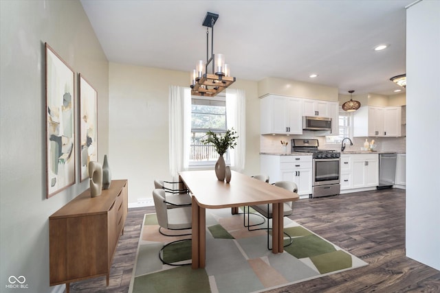 dining space with dark wood-style floors, recessed lighting, and baseboards