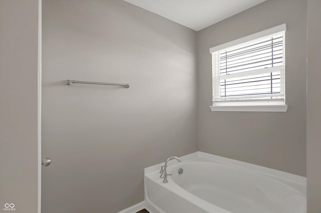 bathroom with a garden tub