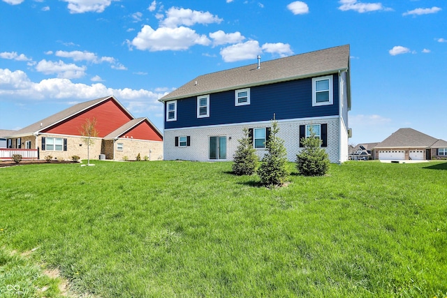 back of house with a yard