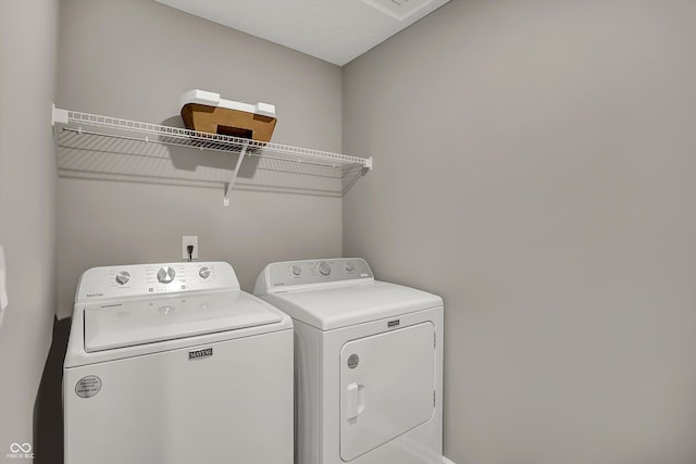 laundry room with independent washer and dryer and laundry area