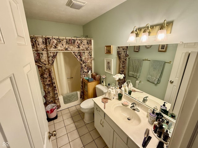 bathroom featuring visible vents, shower / bathtub combination with curtain, toilet, vanity, and tile patterned flooring