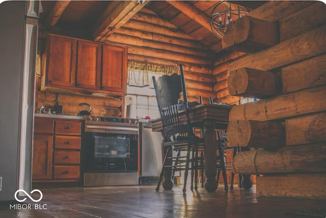 kitchen featuring electric range, log walls, lofted ceiling with beams, and wood finished floors