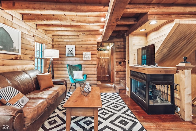 living area with recessed lighting, beam ceiling, a fireplace, and hardwood / wood-style flooring