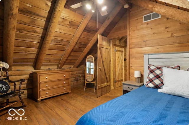 bedroom with visible vents, wooden ceiling, lofted ceiling with beams, and wood-type flooring