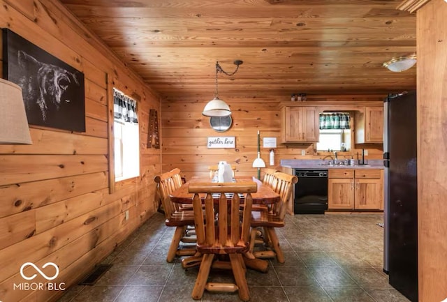 dining room with wooden walls, dark tile patterned floors, wood ceiling, and visible vents