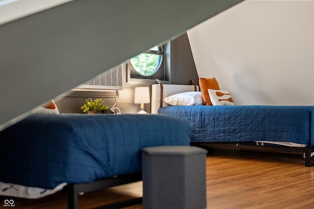 bedroom with wood finished floors