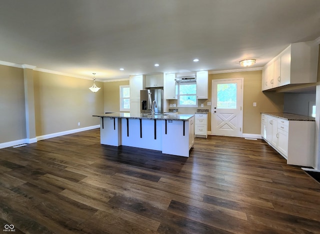 kitchen featuring dark wood-type flooring, white cabinets, and crown molding