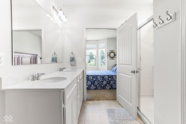 936 Plunkett Ave, Westfield, IN 46074 - bathroom with double vanity, a shower stall, connected bathroom, and tile patterned floors