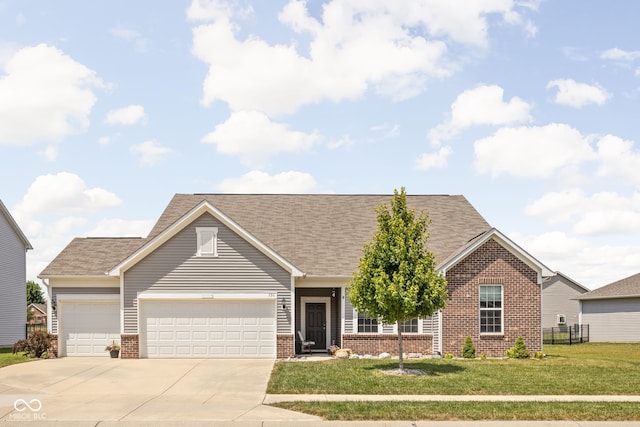 936 Plunkett Ave, Westfield, IN 46074 - view of front facade featuring brick siding, an attached garage, concrete driveway, and a shingled roof