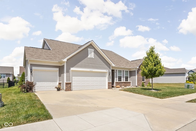936 Plunkett Ave, Westfield, IN 46074 - view of front of home with driveway, a garage, brick siding, and roof with shingles