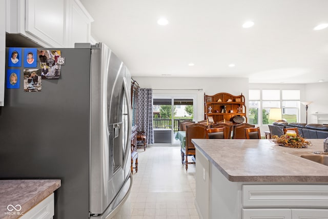 936 Plunkett Ave, Westfield, IN 46074 - kitchen with stainless steel fridge with ice dispenser, white cabinetry, recessed lighting, and open floor plan