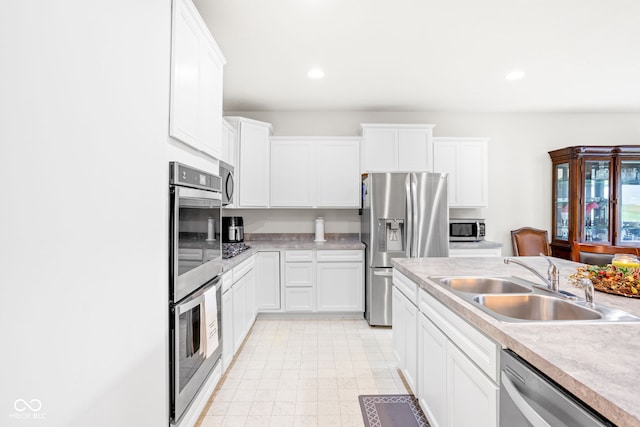 936 Plunkett Ave, Westfield, IN 46074 - kitchen featuring stainless steel appliances, light countertops, white cabinetry, and recessed lighting