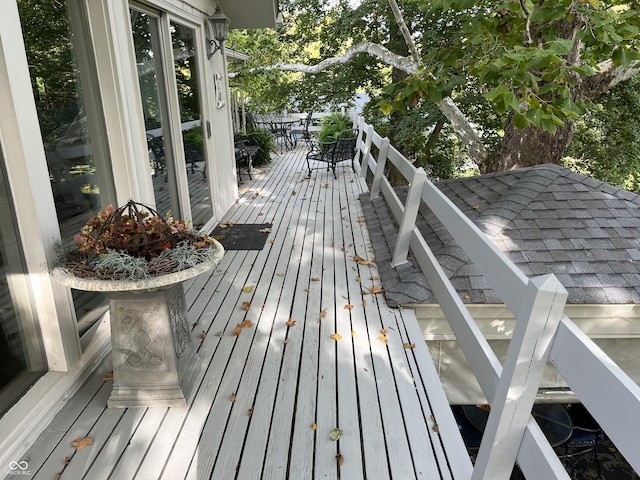 wooden deck featuring outdoor dining area